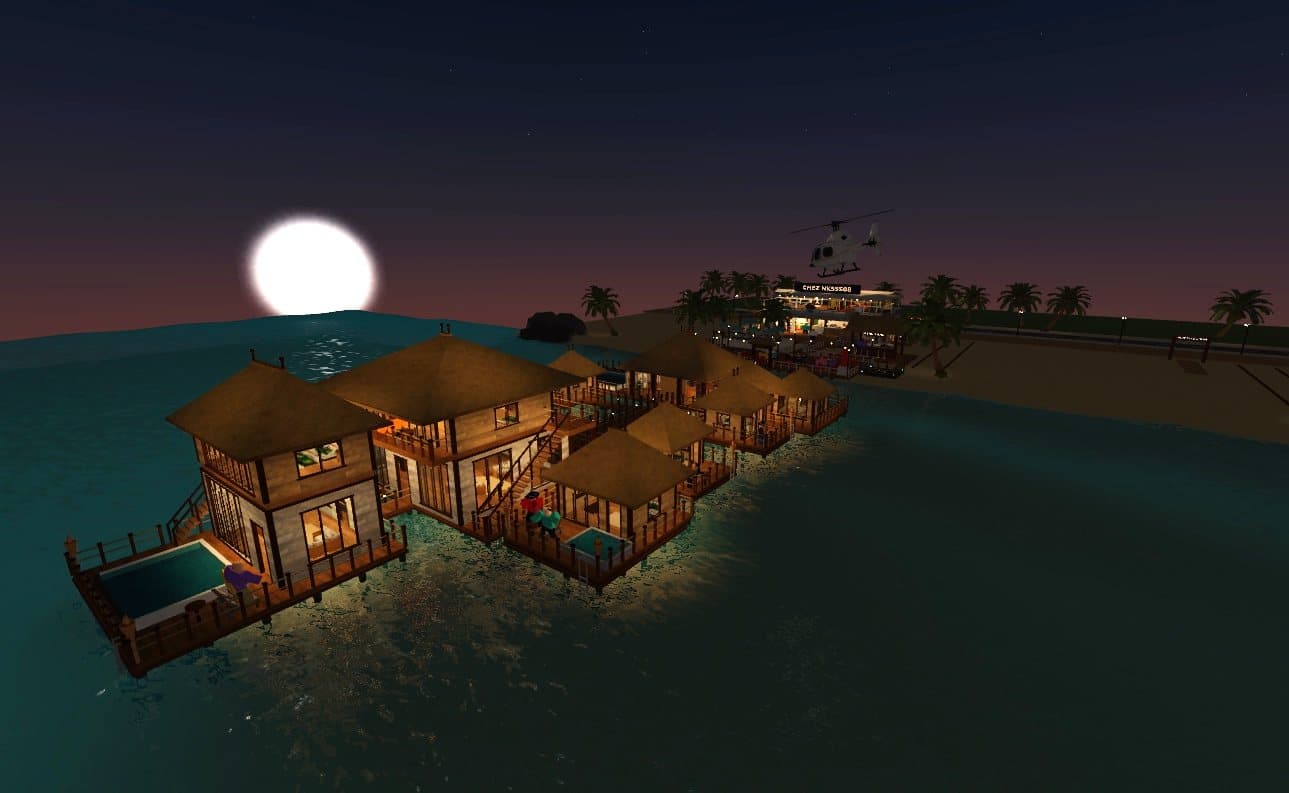 Les bungalows éclairés sous la pleine lune